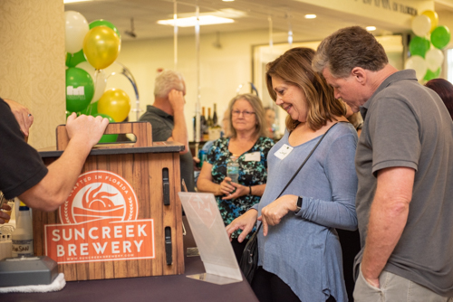 Guests decide which beverage they would like from Suncreek Brewery during Clermont's 2nd Anniversary Celebration